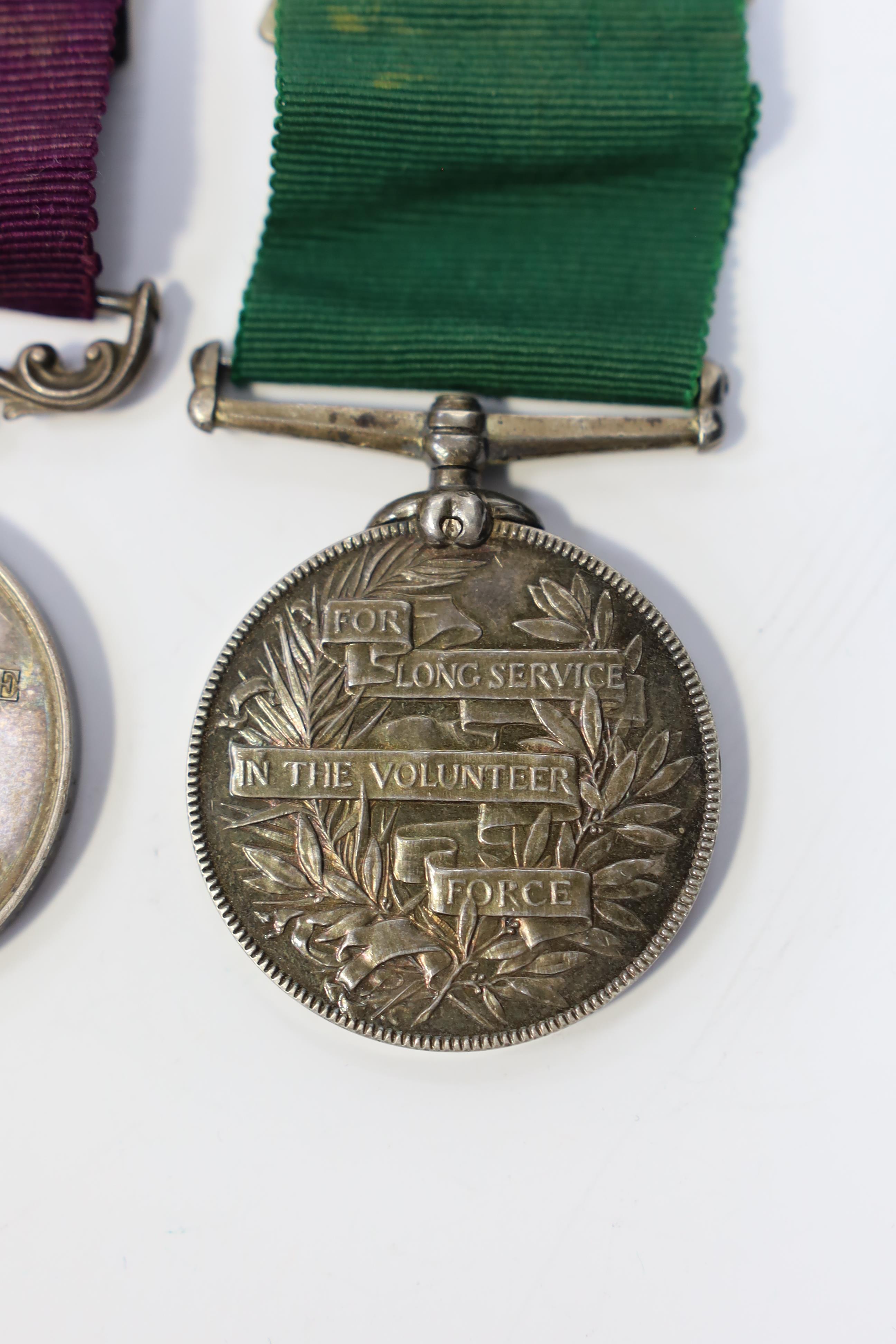 A Victorian LSGC medal to 1843 C:Sgt J.Cook. Gord. High'rs. and an unnamed Victorian Volunteer Long Service medal. Condition - fair